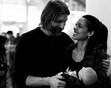 Stephanie with her husband and baby 